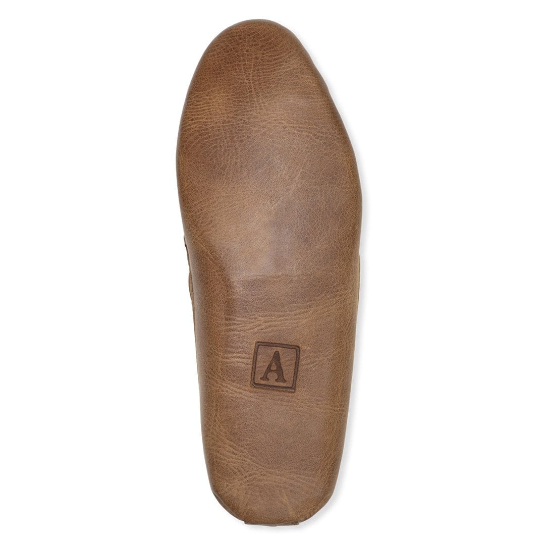 Brown leather moccasin insole with an Adelante A logo and handcrafted leather finish