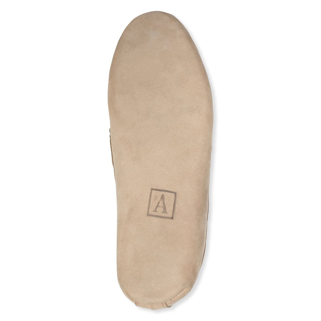 Beige leather insole with Adelante logo, designed for a women's handcrafted moccasin in narrow to extra wide widths
