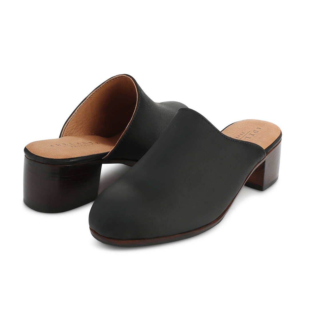 Women's 2E-wide black leather heeled mules, shown at an angle, can be made in size 13 – The Camila