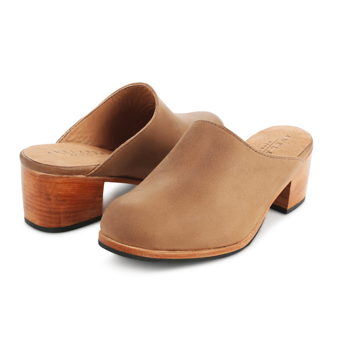 Pair of women's narrow A-width tan leather heeled mules, shown from the front at an angle, made to order for hard-to-fit feet