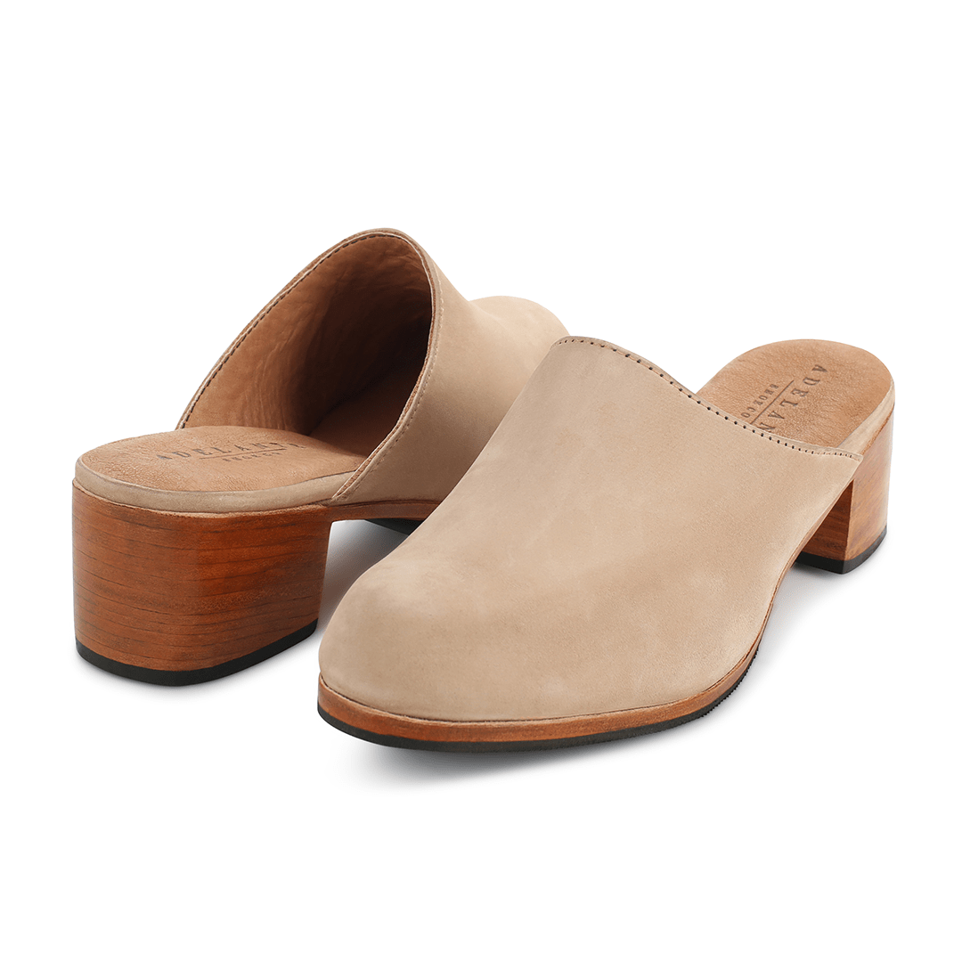 Women's wide cream leather heeled mules, shown from the front at an angle. Crafted for wide and narrow feet – The Camila