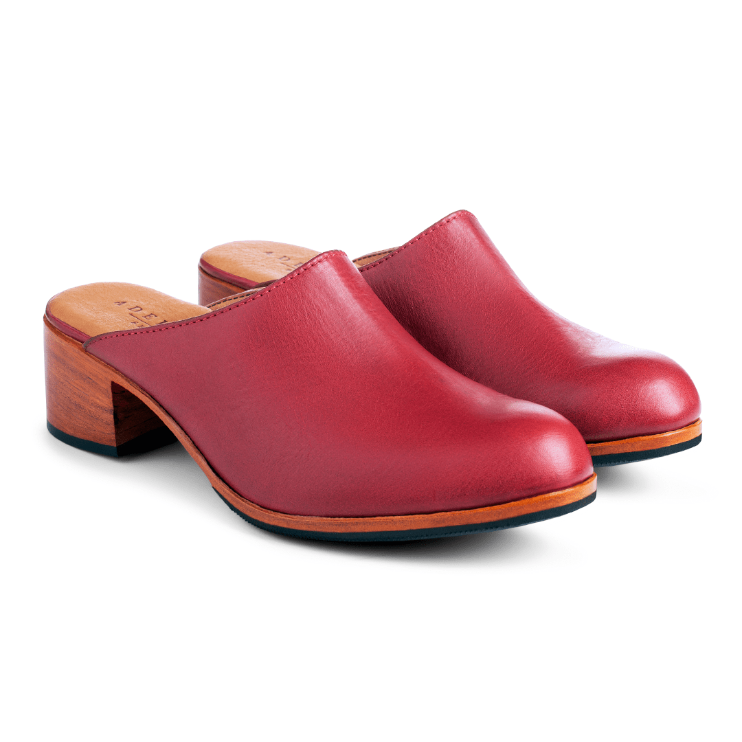 Pair of women's wide red leather heeled mules, shown from the front at an angle, with split sizing for two different-sized feet