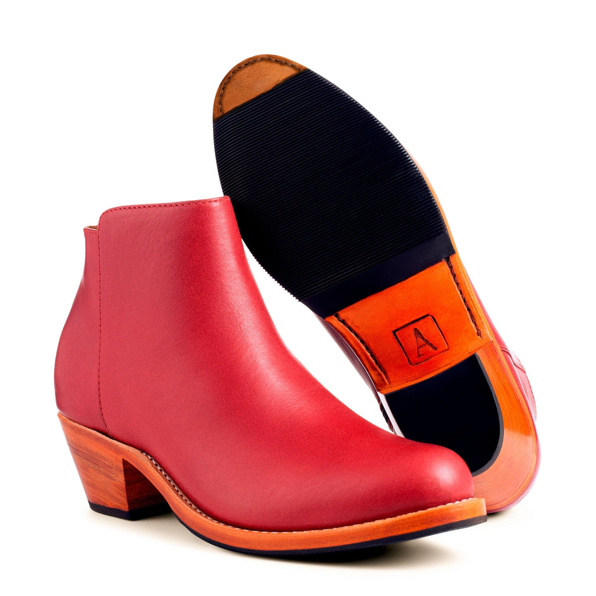 Red womens leather ankle boot with tapered heel and handcrafted sole