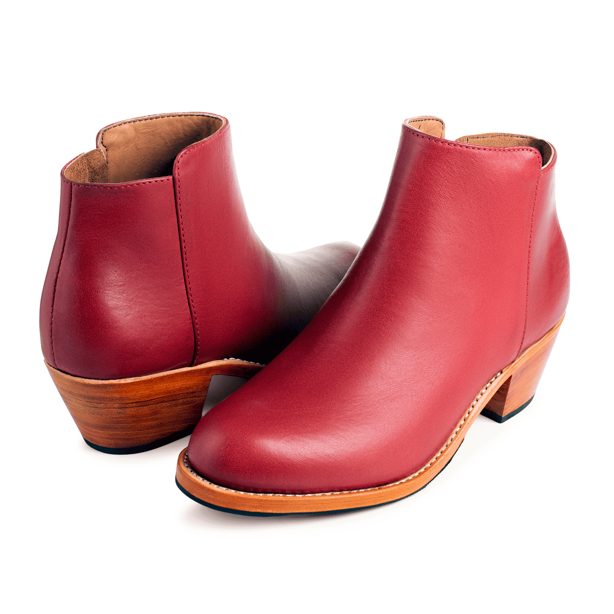 Adelante red leather women's ankle booties with tapered heels and handcrafted construction, available in narrow to extra wide widths