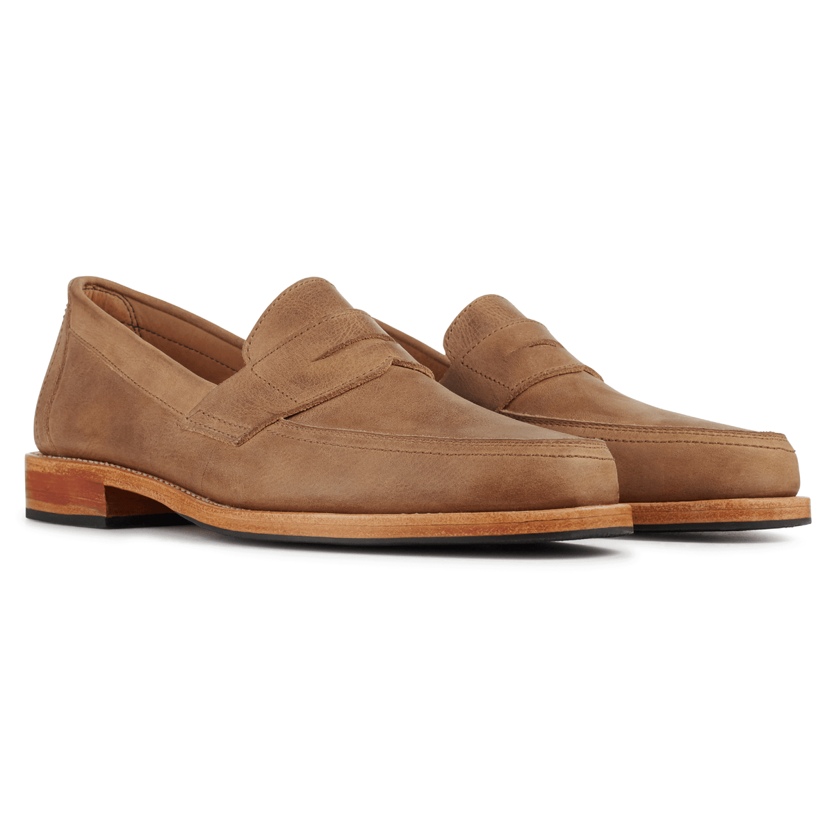 Tan men's penny loafers with classic penny bridges and stacked heels, available in wide widths from Adelante