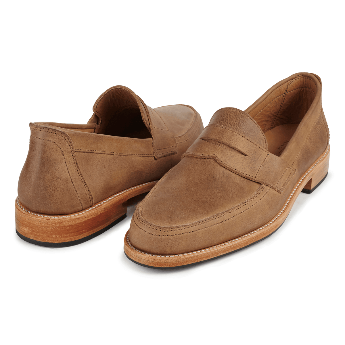 Adelante men's brown penny loafers with a classic penny bridge, sleek toe shape, and handcrafted made to order construction