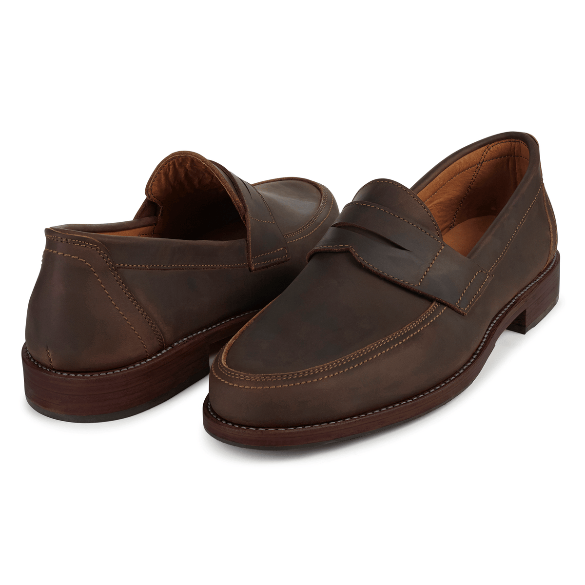 Brown men's penny loafers with classic penny bridges and stitched detailing by Adelante Made-To-Order