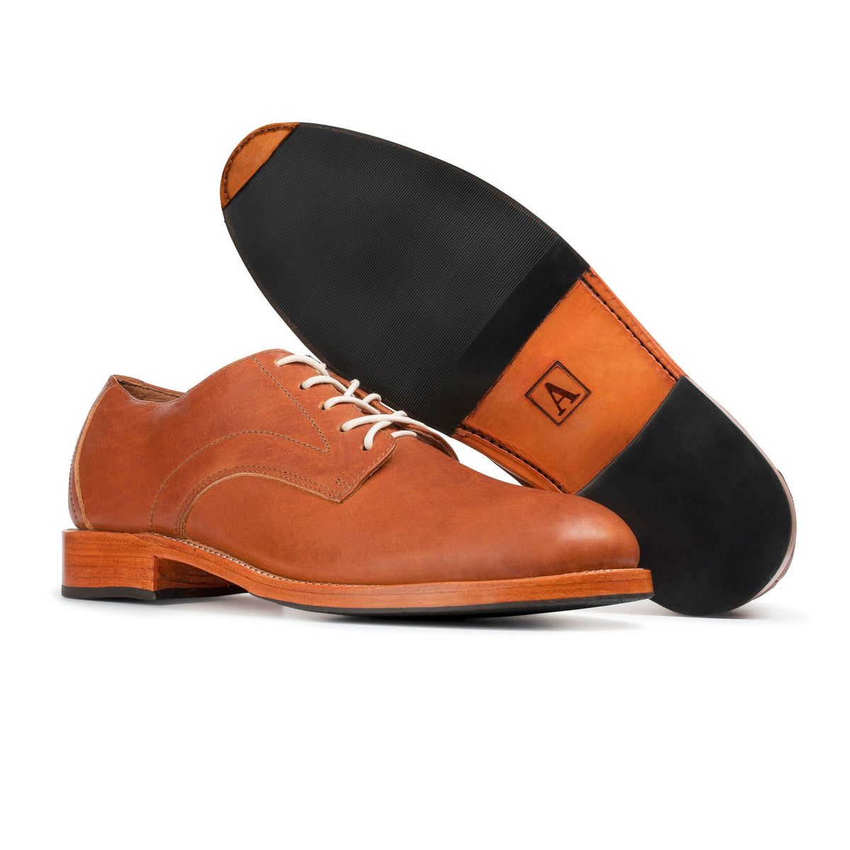 Men's 2E-wide light brown leather derby, shown with the sole turned up – The Romero