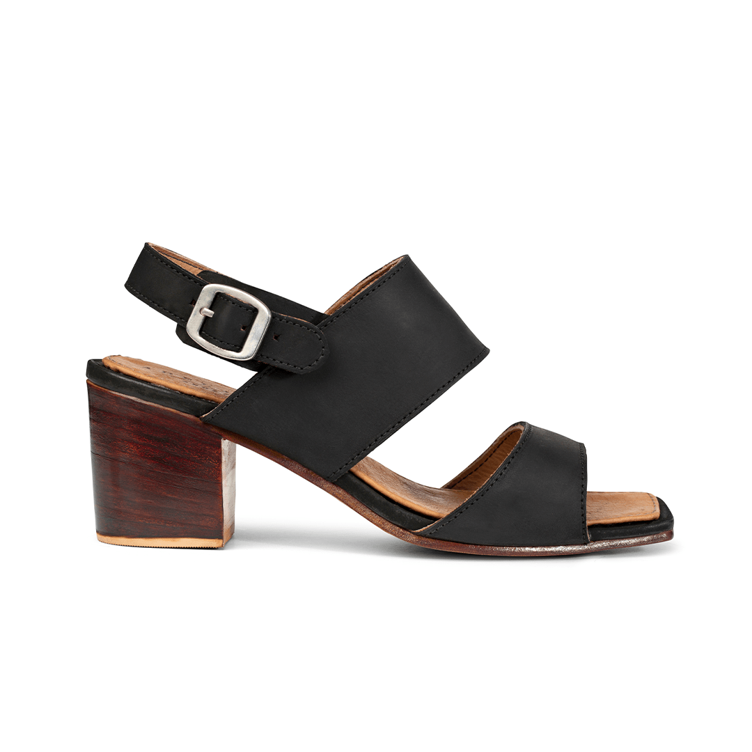 Women's EE wide black leather heeled sandal, seen from the side. Available in every half size – The Serena