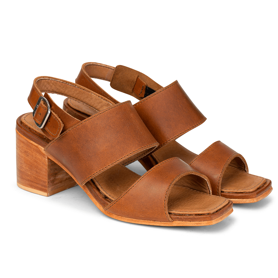 Women's wide light brown leather heeled sandals, shown from the front at an angle. Crafted for wide and narrow feet – The Serena