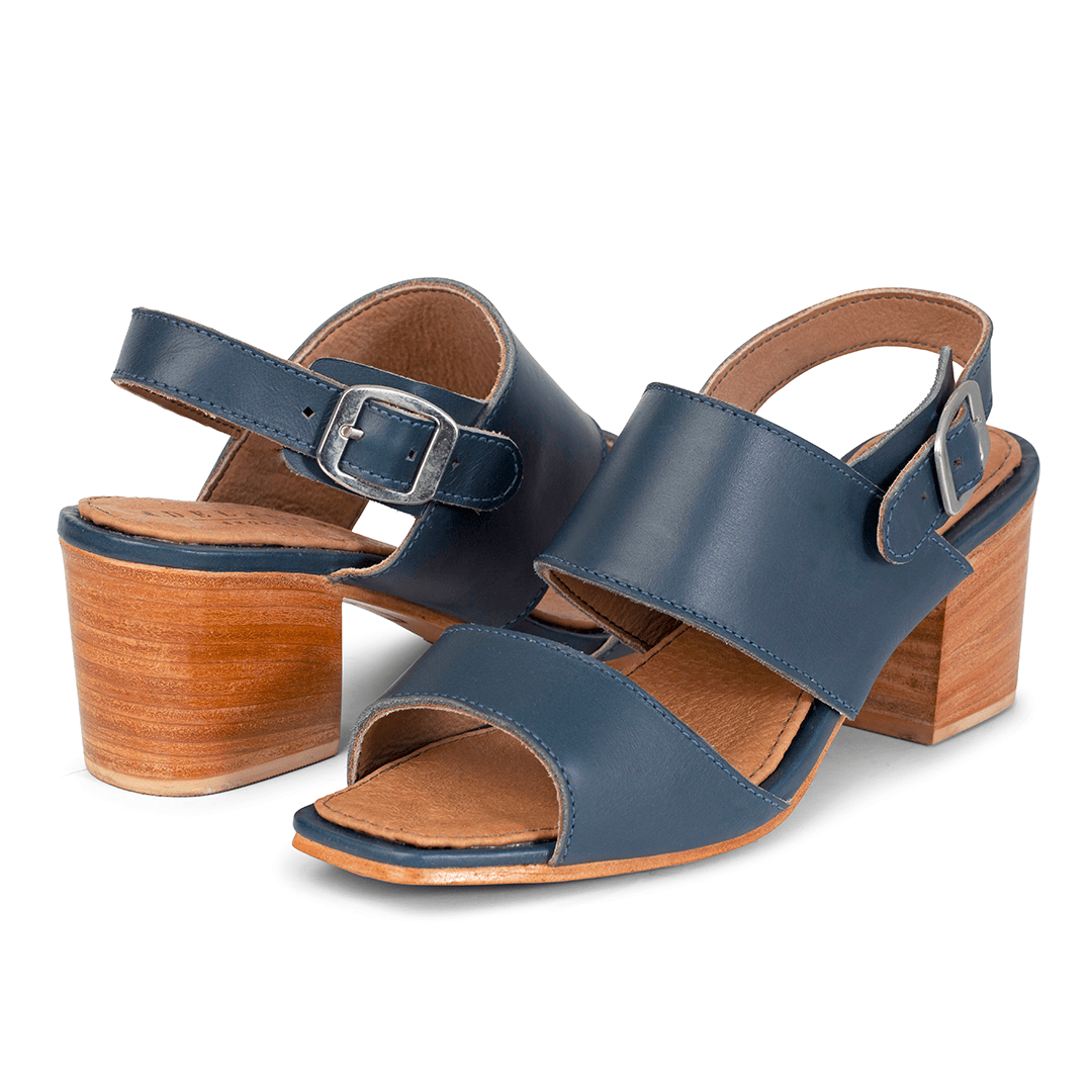 Pair of women's 3E-wide blue leather heeled sandals, shown from the front at an angle, with split sizing for two different-sized feet