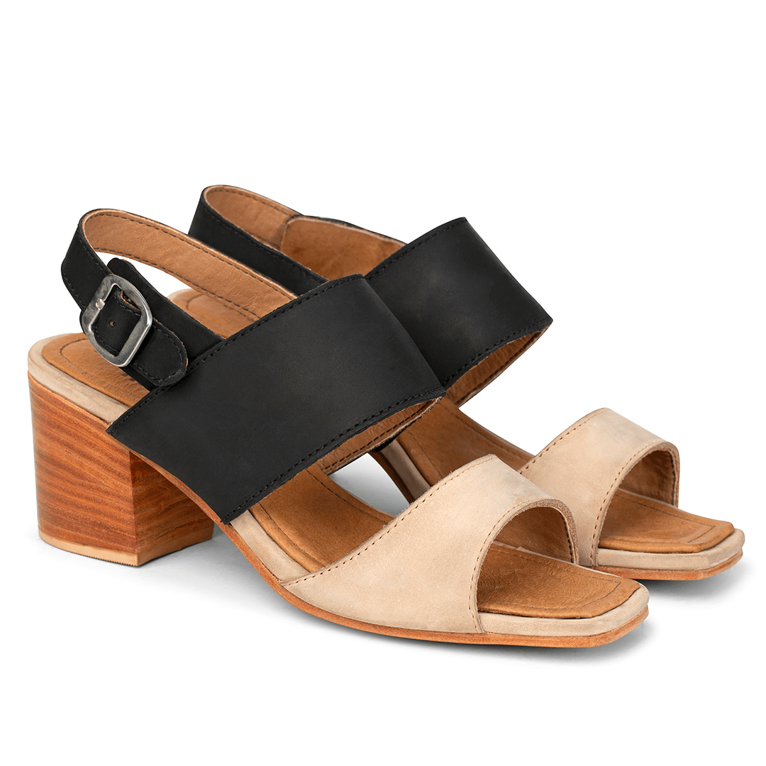 Women's narrow A-width black and cream leather heeled sandals, shown from the front at an angle. Handcrafted to order in Guatemala