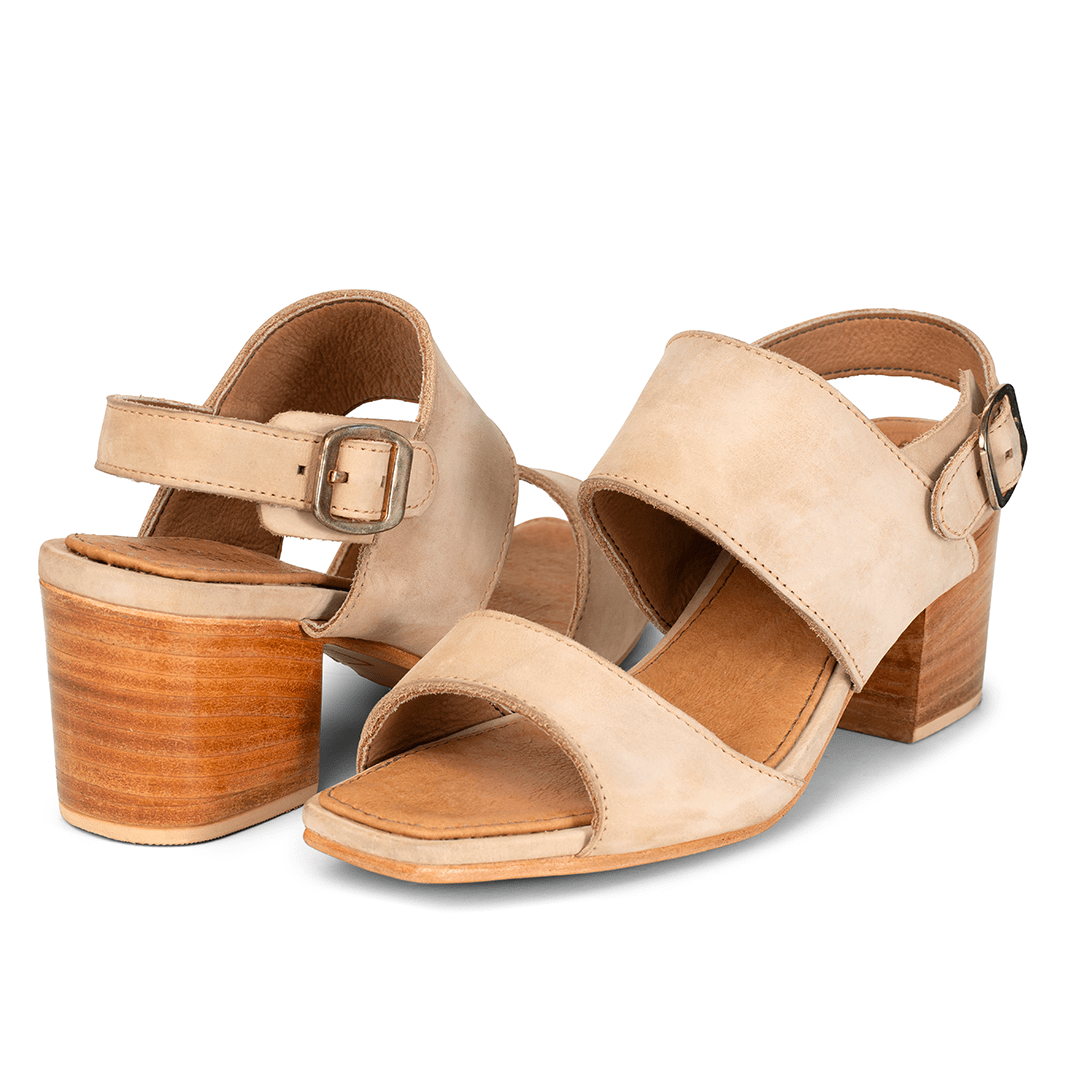 Pair of women's EE wide cream leather heeled sandals, shown from the front at an angle, made to your exact length and width
