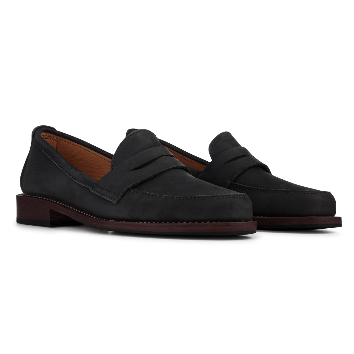 Black women's leather penny loafers with classic penny bridges and low stacked heels, available in narrow to extra wide widths