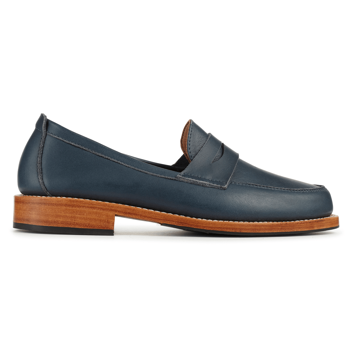 Women's navy leather penny loafer with classic strap and stacked wood-tone heel, available in narrow to extra wide widths