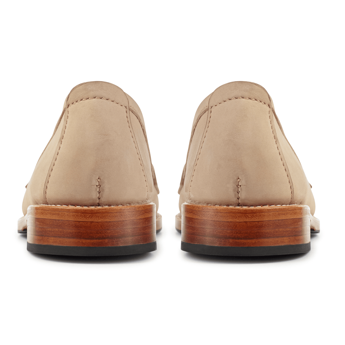 Back view of women's tan leather penny loafers with stacked wood heels and black rubber soles, handcrafted by Adelante Made-To-Order in wide widths