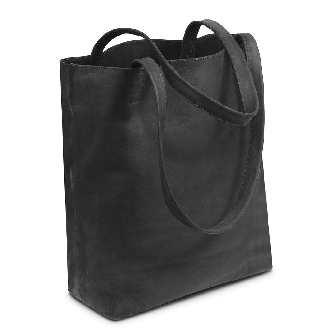 Black leather tote bag, shown at an angle, handcrafted and made to order