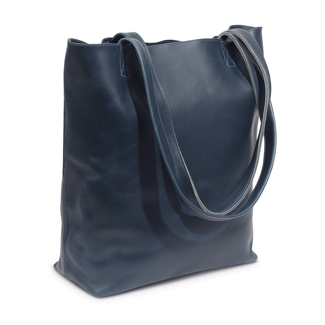 Blue leather tote bag, shown at an angle, full-grain leather, made by hand