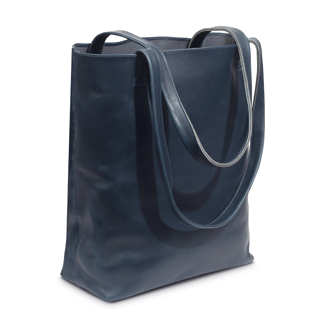 Blue leather tote bag, shown at an angle, handcrafted to order in Guatemala