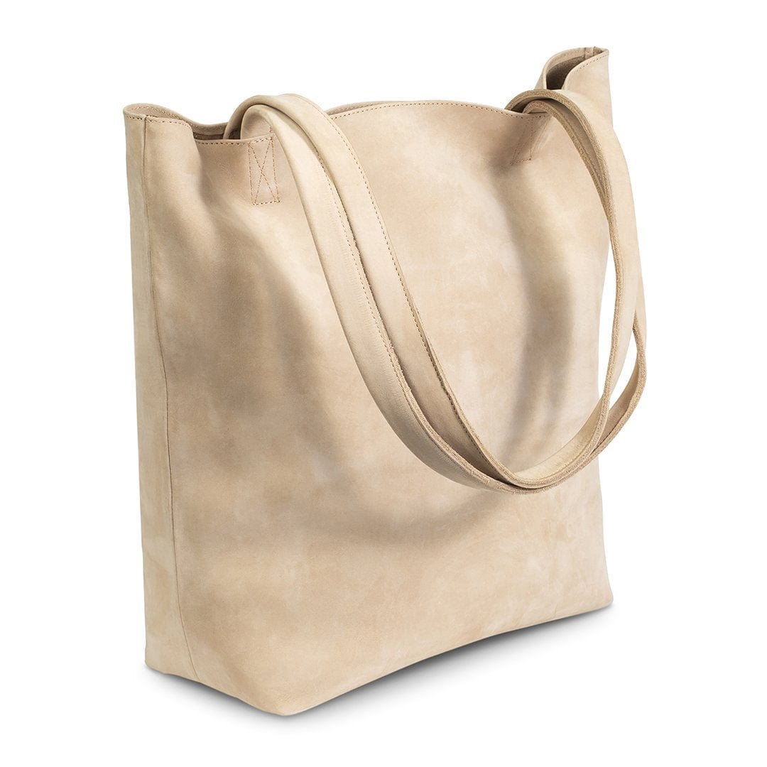 Cream leather tote bag, shown at an angle, full-grain leather, made by hand